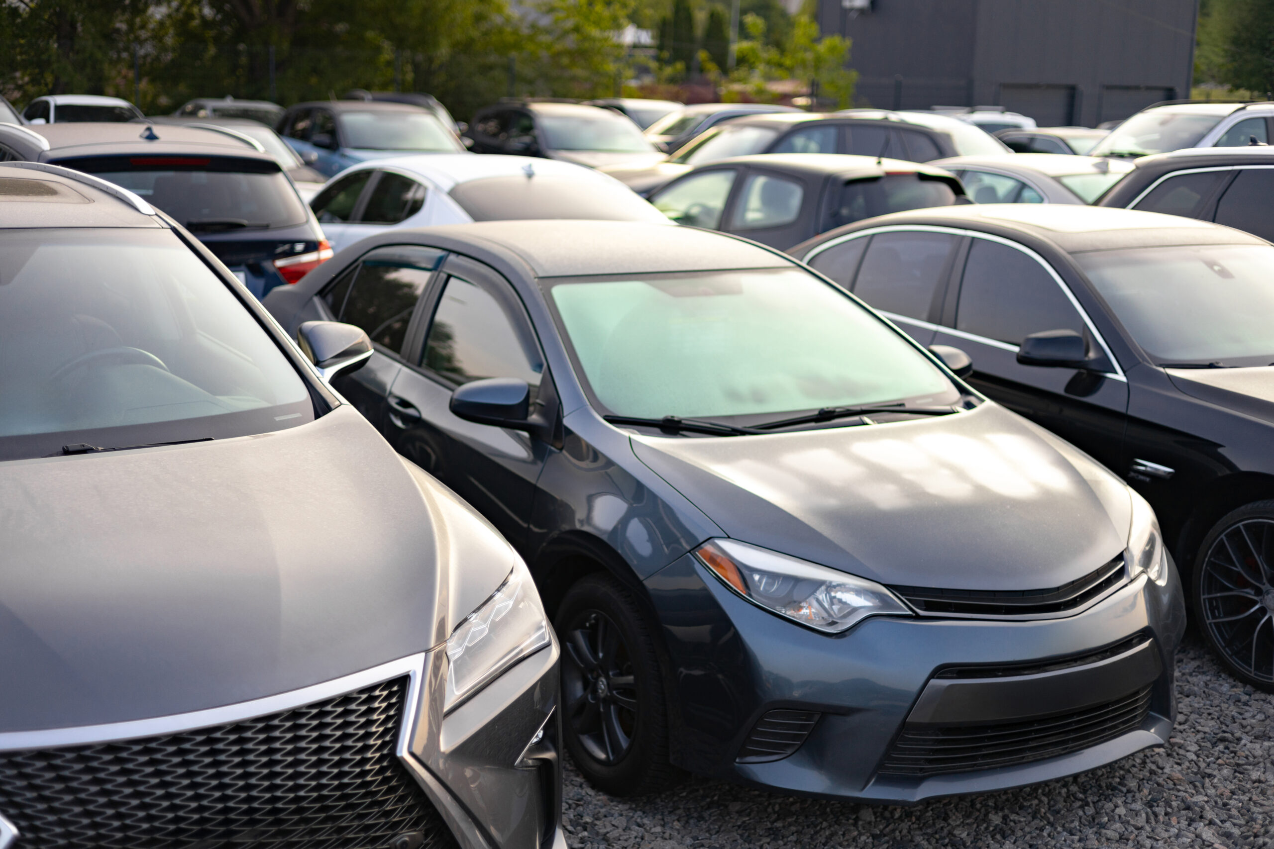 A row of cars parked outdoors.